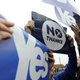 Pro-union (center) and pro-independence campaigners jostle for space during a pro-independence rally in Glasgow, Scotland, on Sept. 12, 2014.
Andy Buchanan/AFP/Getty Images